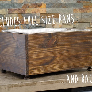 May include: A wooden box with a silver aluminum pan inside. The box has four small wooden legs and is stained a dark brown color. The text "INCLUDES FULL SIZE PANS... AND RACK!" is written on the image.