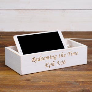 May include: White wooden box with a tablet inside. The box has the text "Redeeming the Time Eph 5:16" engraved on the front.