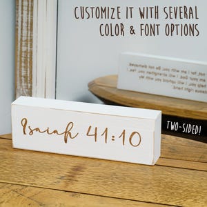 May include: A white wooden block with the inscription "Isaiah 41:10" in a brown script font. The block is two-sided and the text "CUSTOMIZE IT WITH SEVERAL COLOR & FONT OPTIONS" is visible in the background.