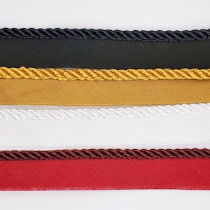3/8" Twisted Satin lip cord piping on 5/8" fabric edging. Sew-in.  Sold by the yard. Great for upholstery and home décor