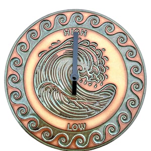 May include: Round, copper-toned tide clock with a wave design. The clock face features the words "HIGH" and "LOW" and a wave illustration. The clock hands are black and gray. The outer edge has a decorative swirl pattern.