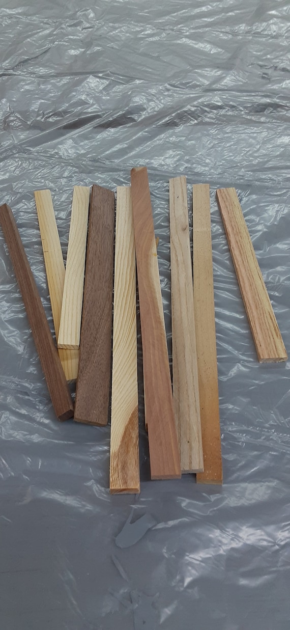 100 piece thin wood strips multiple woods types. Different lengths and  thickness