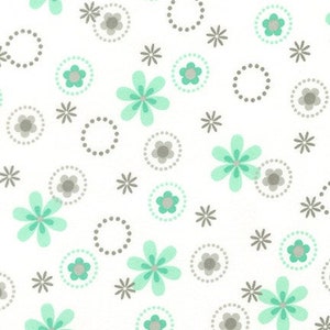 May include: A seamless pattern featuring a repeating design of light green flowers and gray circles on a white background.