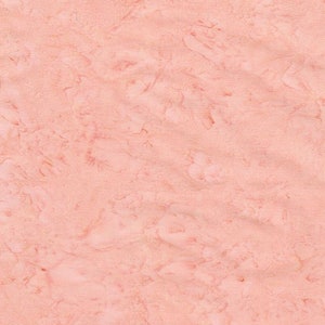 May include: A close-up of a light pink fabric with a marbled pattern. The fabric has a subtle texture and a soft, faded look.