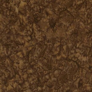 May include: A close-up of a fabric with a mottled pattern in shades of brown and tan. The design has a textured appearance, with swirling and organic shapes creating a natural, earthy aesthetic. The fabric appears to be suitable for various craft projects.