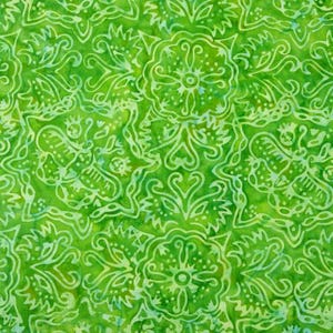 May include: A green fabric with a white floral pattern. The pattern is intricate and includes swirls, leaves, and flowers.