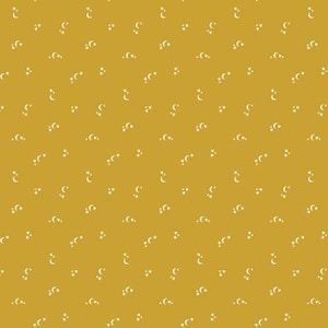 May include: A seamless pattern featuring white crescent moons and stars on a mustard yellow background.
