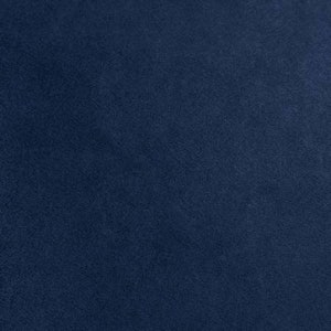May include: A solid dark blue fabric background.