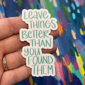 May include: White sticker with the text "Leave things better than you found them" in teal lettering.