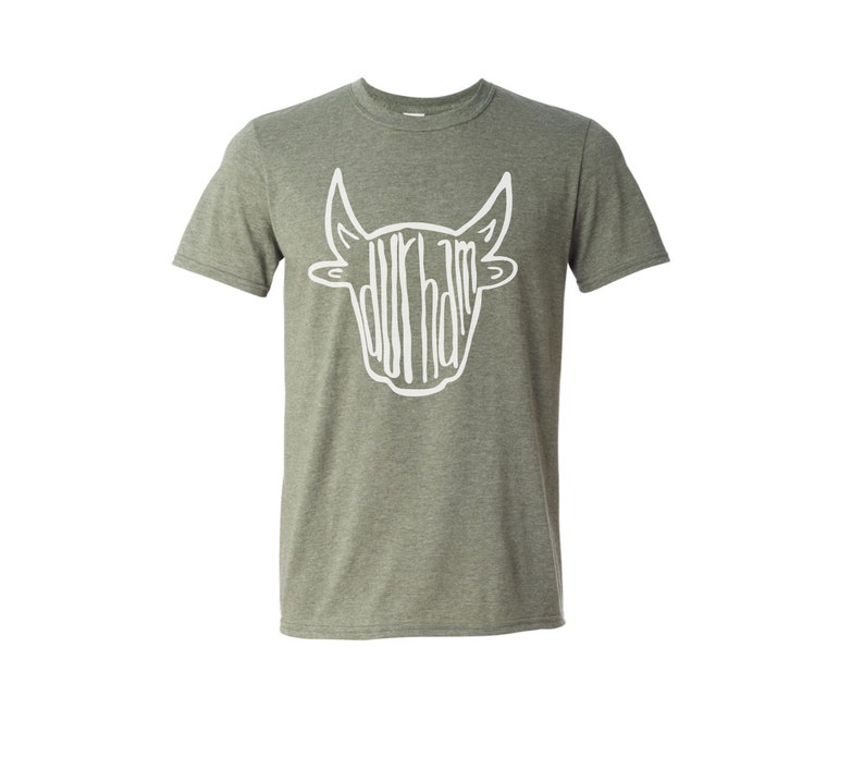May include: A green heather t-shirt with a white bull head graphic. The bull head is made up of the word "Durham" in a stylized font.
