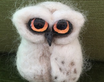 Cute little fluffy needle felted owl chick