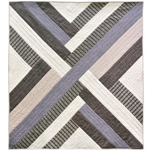 May include: A quilt with a geometric pattern of intersecting diagonal stripes in shades of gray, white, and light pink.