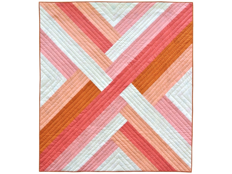 May include: A geometric quilt with a pattern of diagonal stripes in shades of orange, pink, and white.