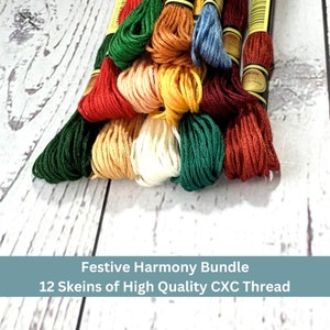 May include: A bundle of 12 skeins of CXC thread in various colors, including red, green, yellow, and cream. The thread is arranged in a neat pile, with the labels visible. The text "Festive Harmony Bundle" is displayed.