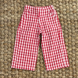 May include: Red and white gingham wide-leg pants with a relaxed fit.