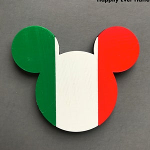 May include: A green, white, and red Mickey Mouse head shaped ornament. The ornament is painted in the colors of the Italian flag.