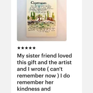 May include: A cream-colored card with the word "Capernaum" at the top, followed by handwritten text and a small illustration of a landscape with trees and buildings. The card also includes additional text.