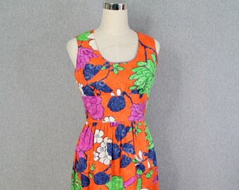May include: A sleeveless maxi dress with a vibrant orange background and a large floral print in shades of pink, white, green, and blue.