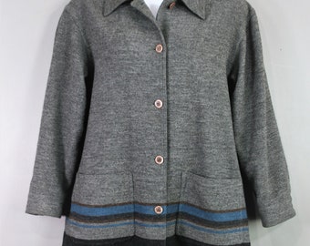 May include: A gray jacket with a collared neckline and three-quarter sleeves. The jacket has a button-up front and two front pockets. The bottom of the jacket features horizontal stripes in blue, brown, and black.
