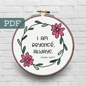 May include: A white embroidery hoop with a floral wreath design. The hoop features the text "I am Beyoncé, always." with the words "Michael Scott" underneath.