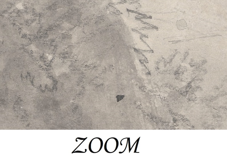 May include: A close-up of a textured, gray surface with a black triangle shape in the center. The surface has a rough, uneven texture, and there are faint lines and markings visible.