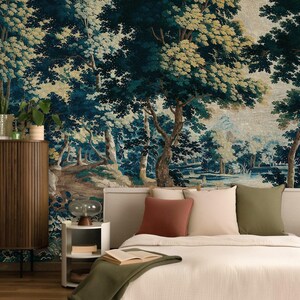 Vintage medieval wall tapestry mural in rich deep blue, green, and warm earthy tones, featuring an antique forest scene with mature trees, dense foliage and a tranquil stream, styled in a restful bedroom with a soft upholstered bed, layered neutral bedding, warm wood furnishings, and muted green accents. The historic woodland creates a restful sanctuary with timeless European character, perfect for Airbnb hosts or renovators seeking a distinctive Arts and Crafts bedroom design.
