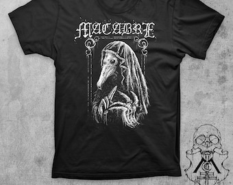 May include: Black t-shirt with a white graphic of a hooded figure with a bird-like mask holding a knife. The text "MACABRE" is above the figure.