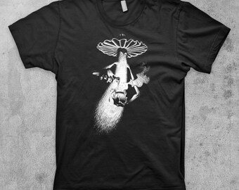 May include: Black t-shirt with a white graphic of a mushroom with a face and a creature holding a glowing orb.