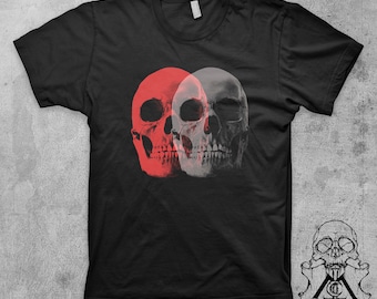 May include: Black t-shirt with a graphic of two overlapping skulls. One skull is red and the other is white.
