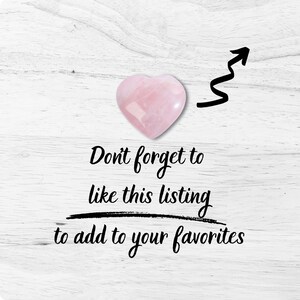 Polished pink heart-shaped crystal on whitewashed wood background with black arrow and brush-script text “Don’t forget to like this listing to add to your favorites,” highlighting a Black Tourmaline natural stone crystal specimen for gemstone collection, healing grids and boho decor.
