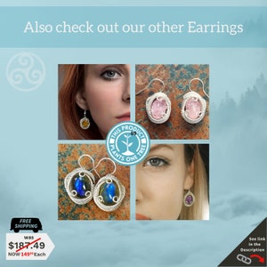 May include: A set of silver wire wrapped earrings with a variety of gemstone cabochons. The earrings feature a pink, blue, and a yellow gemstone. The earrings are shown on a model's ear and on a white background.
