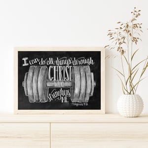 May include: Black framed art print with a chalkboard style design. The print features a dumbbell illustration with the text "I can do all things through Christ who strengthens me - Philippians 4:13."