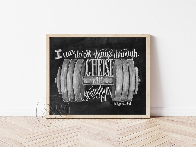 May include: Black chalkboard art print with a wooden frame. The artwork features a dumbbell illustration with the text "I can do all things through Christ who strengthens me" and the Bible verse Philippians 4:13.