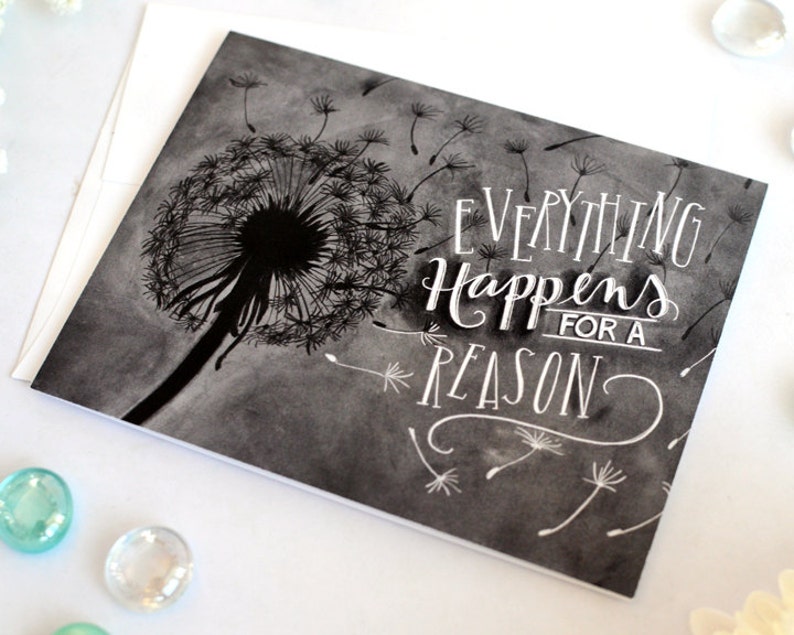 May include: Black and white illustration of a dandelion with the text "Everything Happens for a Reason" written in white.