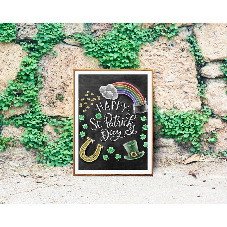 May include: A chalkboard sign with a green background and white chalk lettering that says "Happy St. Patrick's Day". The sign is decorated with a rainbow, a pot of gold, a horseshoe, and a leprechaun hat.