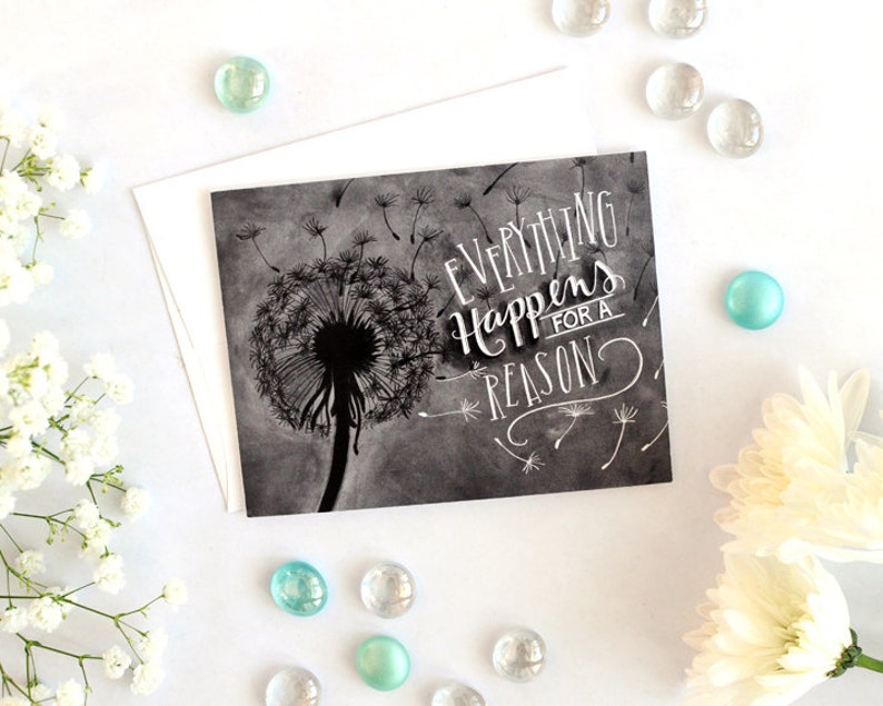 May include: A black and white card with a dandelion illustration and the text "Everything Happens for a Reason".