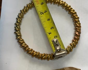 Una mitad de un anillo de energía tensorial de cobre de 999 codos en cobre doblemente trenzado.
