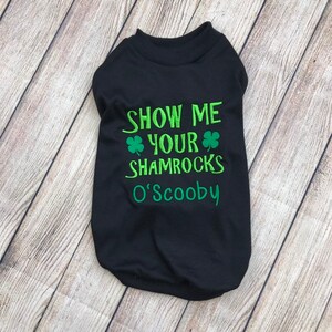 May include: Black dog shirt with green shamrock embroidery and the text "Show me your shamrocks O'Scooby".