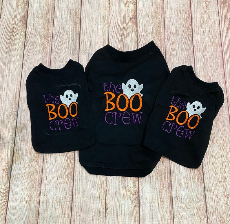 May include: Three black t-shirts with the text "the BOO crew" and a white ghost graphic. The shirts are in different sizes.