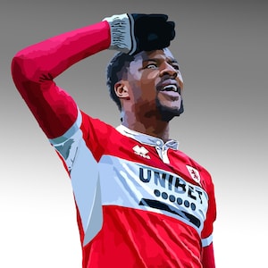 May include: A soccer player wearing a red and white jersey with the word "UNIBET" on the front. The player is wearing a black glove on his right hand and is looking up.
