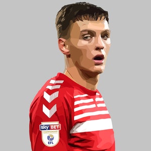 Puede incluir: Un joven con una camiseta de fútbol roja y blanca con un patrón de chevron blanco en la manga. La camiseta tiene un parche con el texto "sky BET CHAMPIONSHIP EFL".