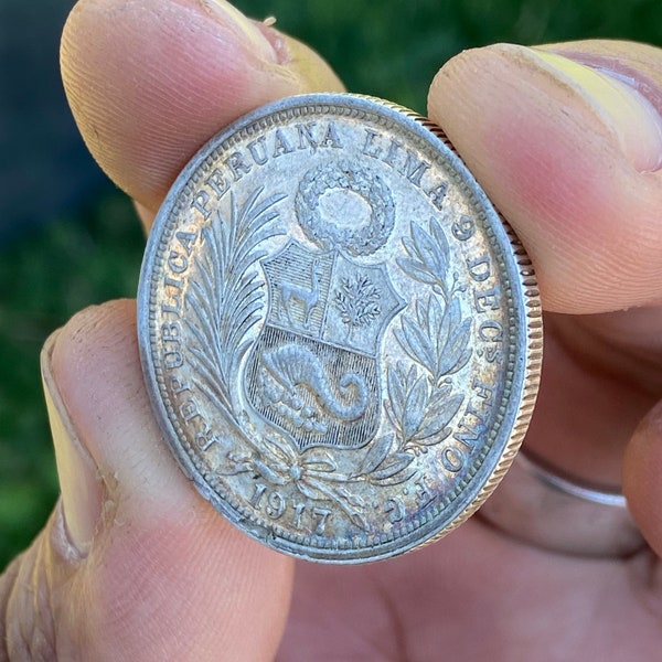 1917 Peru 1/2 Sol Silver Coin with gorgeous cabinet toning.