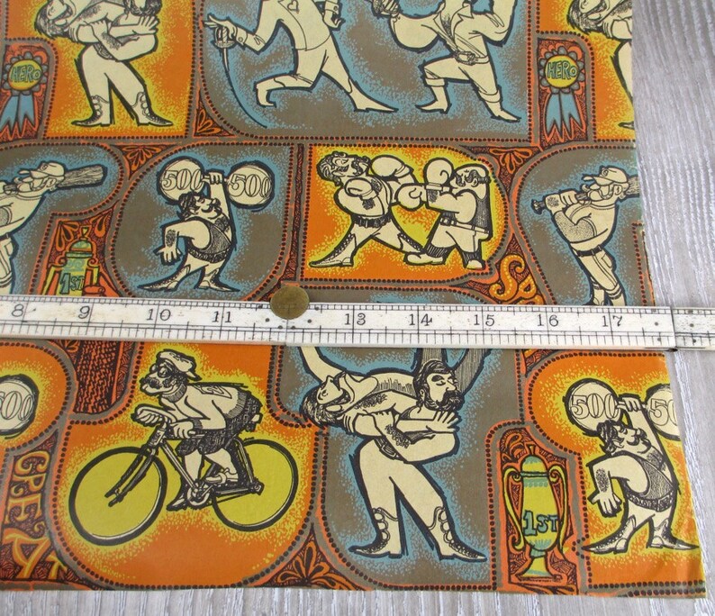 May include: A colorful wrapping paper with a repeating pattern of athletes in various sports. The paper features a wrestler, a boxer, a weightlifter, a cyclist, and a baseball player. The paper is decorated with orange, yellow, blue, and brown colors.