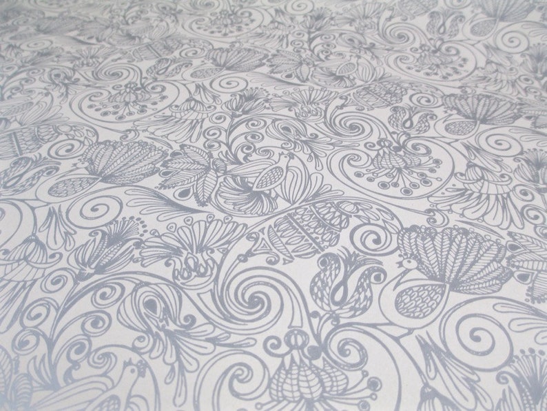May include: A white fabric with a gray floral pattern. The pattern features stylized flowers, leaves, and birds. The design is intricate and detailed.