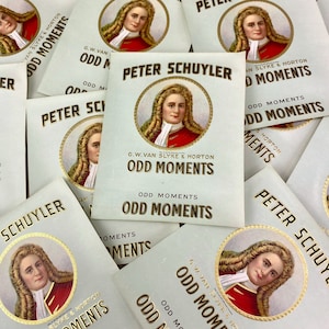 May include: A collection of vintage tobacco cards featuring a portrait of Peter Schuyler. The cards are printed with the text "G.W. Van Slyke & Horton Odd Moments".