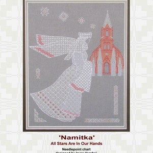 May include: A needlepoint chart titled 'Namitka' with the text 'All Stars Are In Our Hands'. The chart depicts a woman in a white dress with a red trim, standing in front of a red church building. The background is a gray pattern.