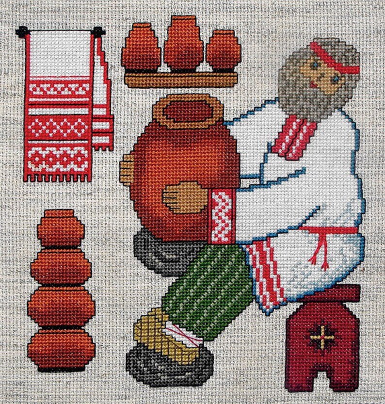 May include: A cross-stitch pattern depicting a man in traditional clothing making pottery. He is sitting on a stool and holding a large clay pot. There are smaller pots stacked on a shelf behind him.