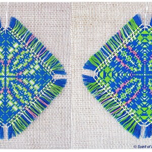 May include: Two square blue, green, white, and pink embroidered coasters with fringe. The coasters are on a beige background.