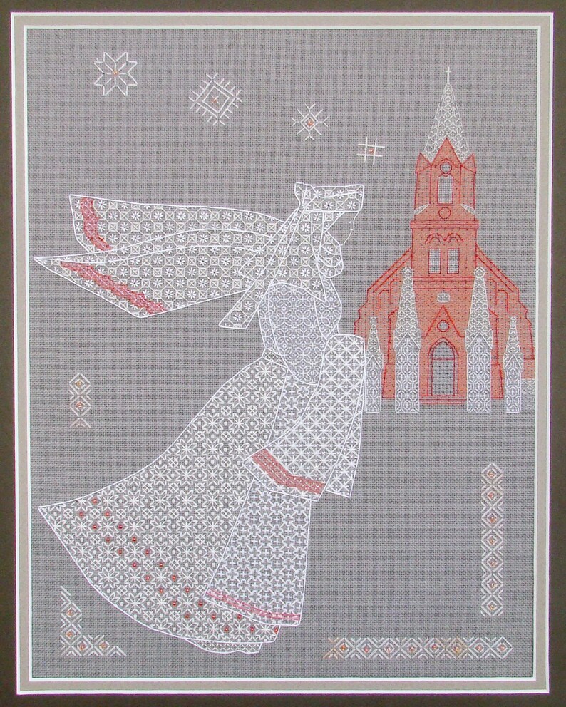 May include: White embroidered design of a woman in a long dress and veil walking towards a red church building with white trim. The background is a light gray fabric.