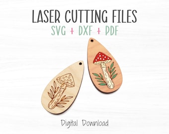 May include: Two laser cut wooden mushroom earrings. One earring features a red and white mushroom with green leaves. The other earring features a brown mushroom with green leaves. The text "LASER CUTTING FILES SVG + DXF + PDF" is at the top of the image. The text "Digital Download" is at the bottom of the image.